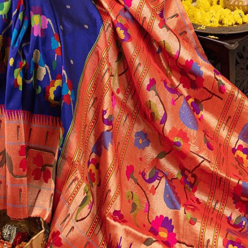 Originating from the town of Paithan, these sarees are renowned for their vivid colors, intricate zari borders, and motifs inspired by nature, such as peacocks and flowers; Image credits: Bholi Sarees